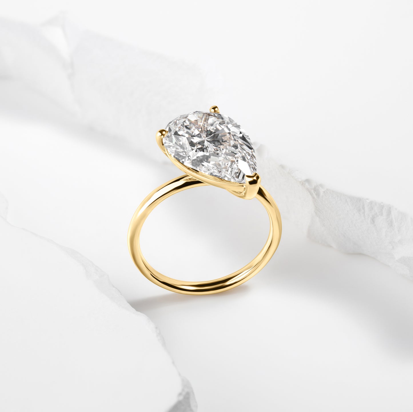 Offset Pear Solitaire Ring