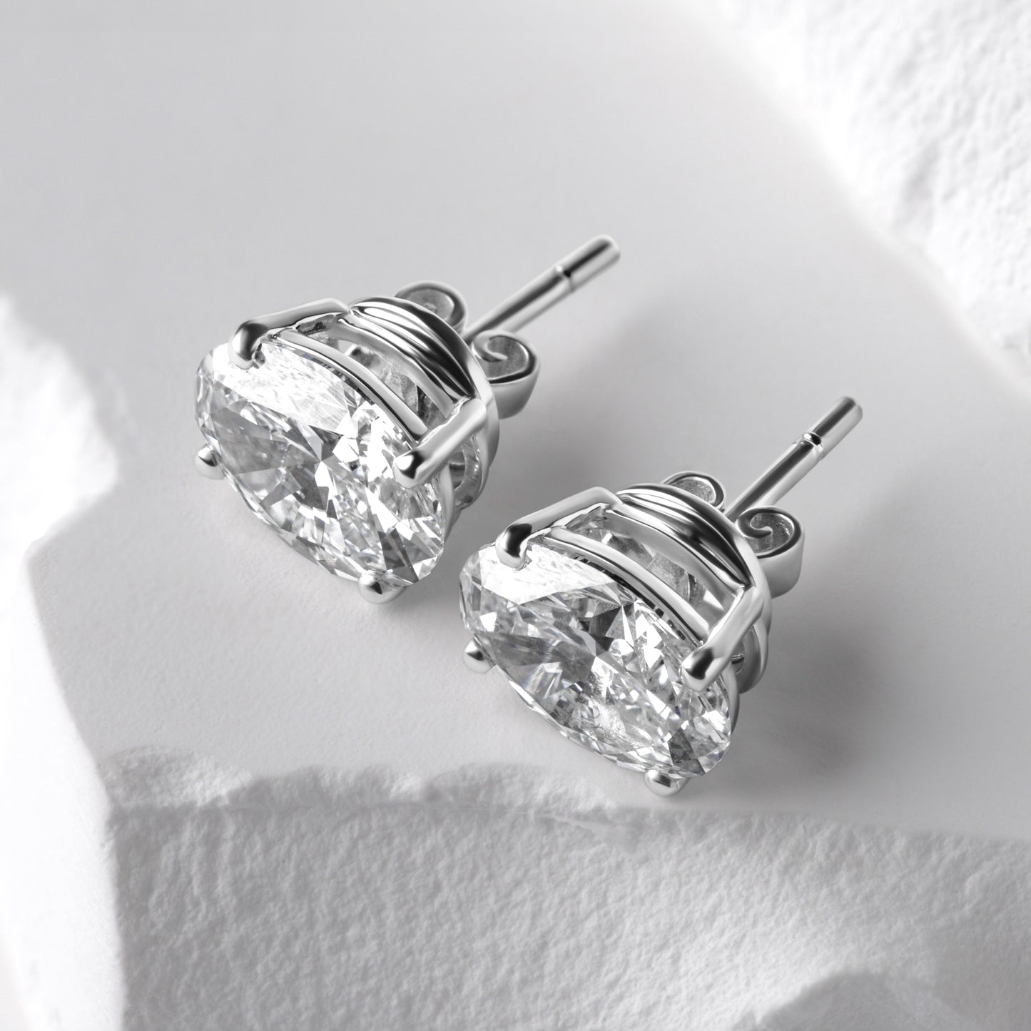 Oval diamond stud earrings side