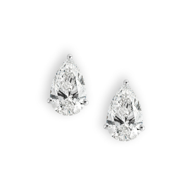 Pair of pear cut diamond earrings set in white gold